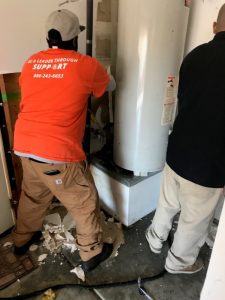 water-damage-restoration-water-heater-wall